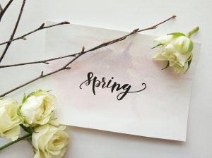 a Spring letter surrounded by flowers