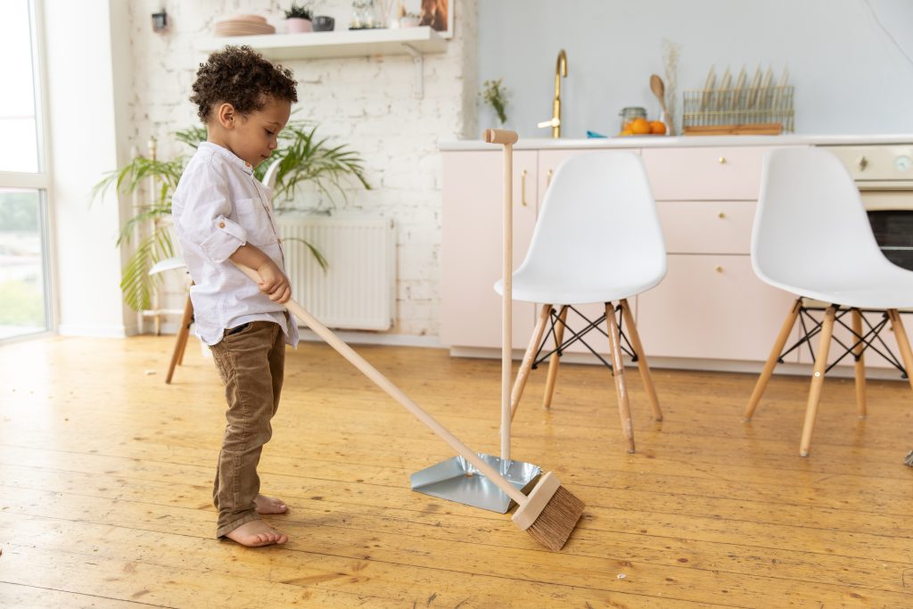 boy cleaning for Passover
