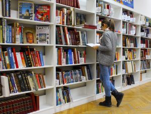woman reading a book in library