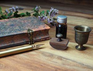 Ink and feather quill ancient writing